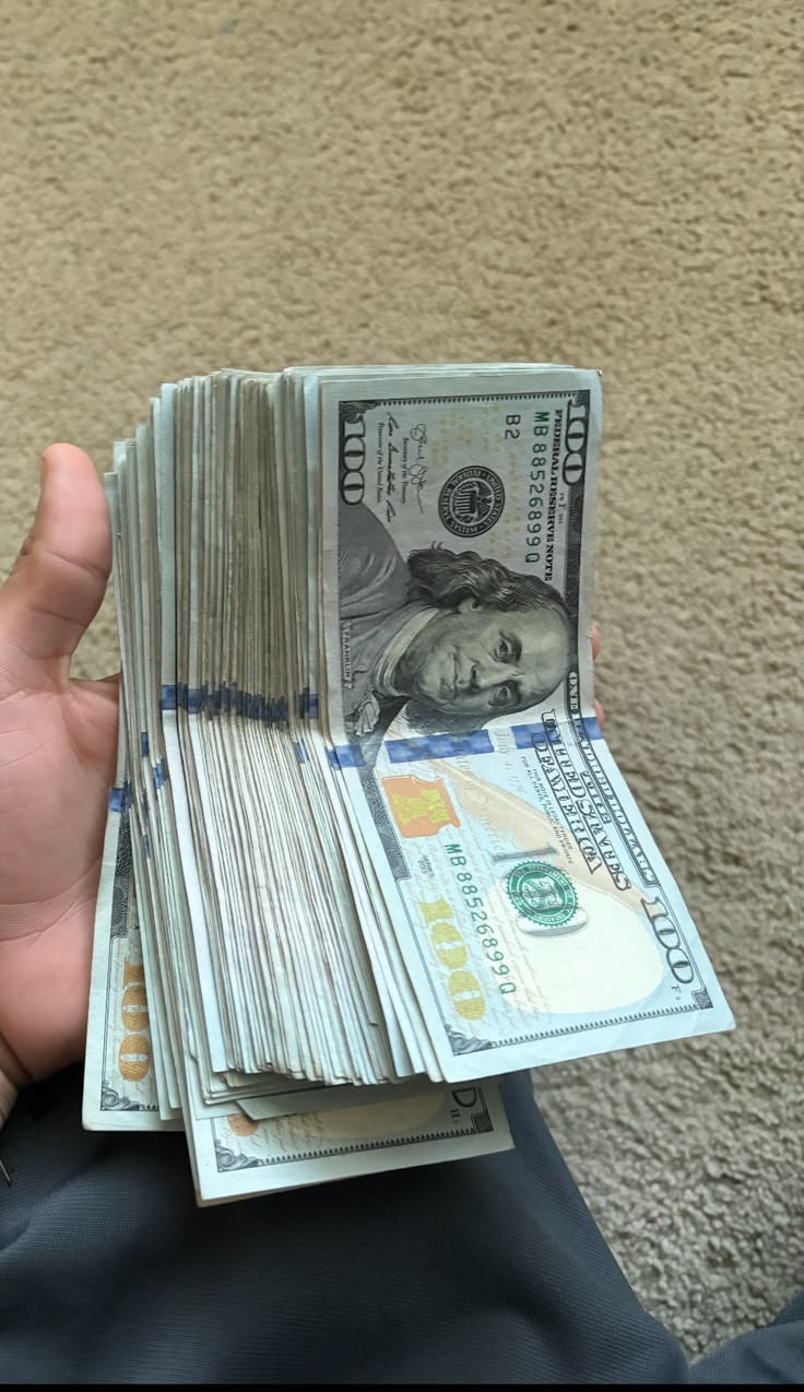 Stack of $100 notes from a reselling flip