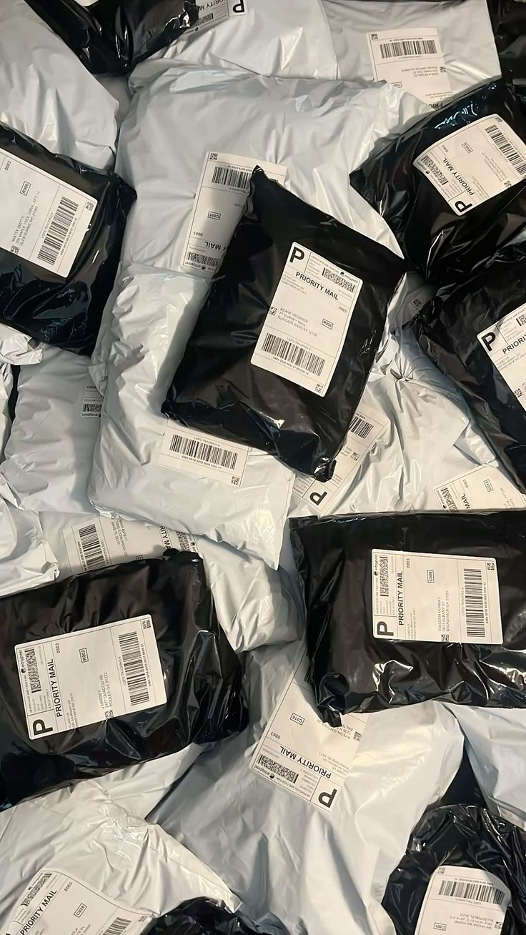 Stacks of packed Priority Mail orders ready to ship
